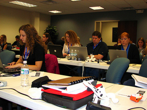 Attendees taking notes at SBMU